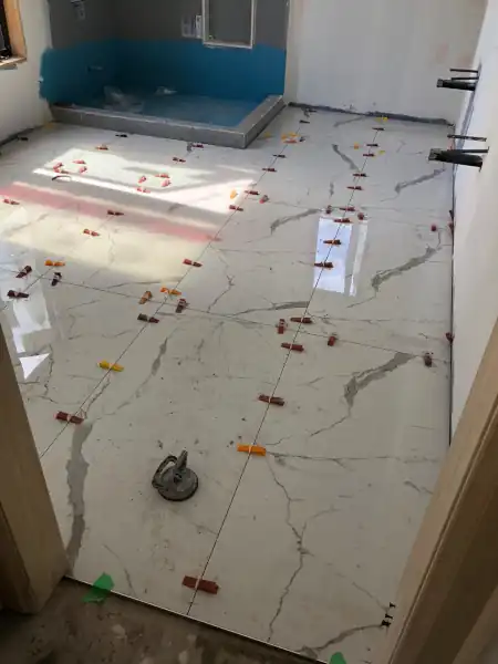 Mosaic tile shower floor installation in progress